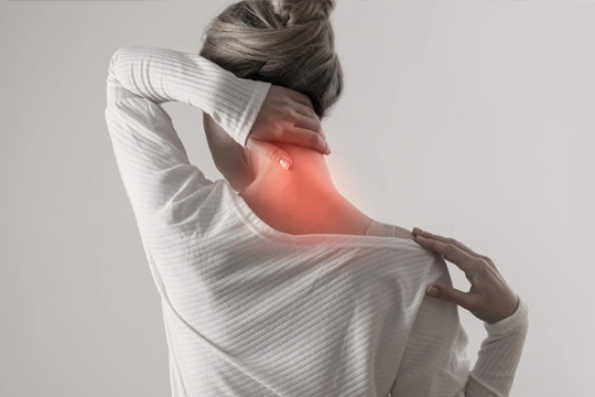 Person touching the back of their neck